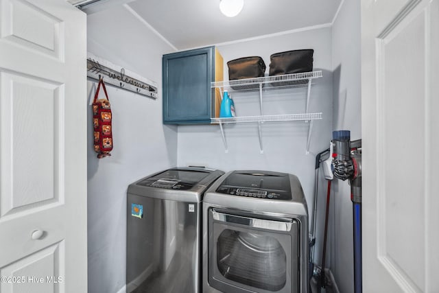 135 NE 34th St, Oak Island, NC 28465 - laundry area with washing machine and dryer and cabinet space