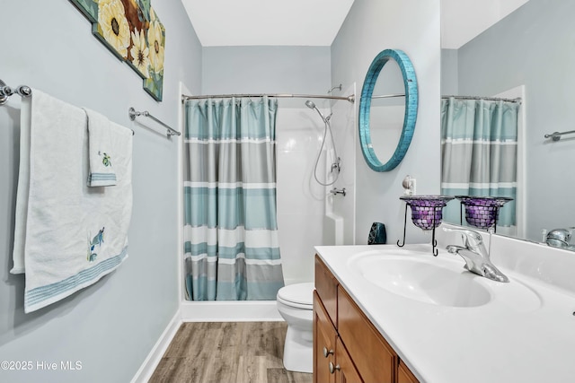 1335 Arbor Ridge Way, Leland, NC 28451 - full bath with vanity, wood finished floors, toilet, curtained shower, and baseboards