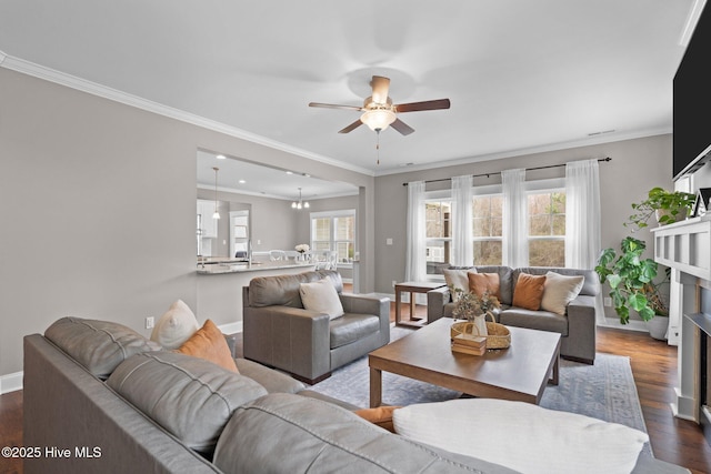 264 Bibey Rd, Carthage, NC 28327 - living area with a ceiling fan, healthy amount of natural light, baseboards, dark wood-style floors, and crown molding