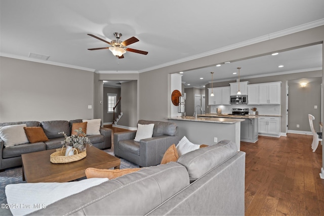 264 Bibey Rd, Carthage, NC 28327 - living room featuring crown molding, a ceiling fan, stairs, dark wood-style flooring, and recessed lighting