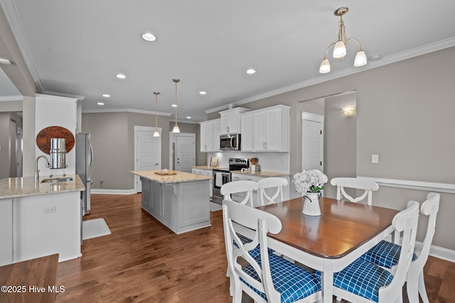 264 Bibey Rd, Carthage, NC 28327 - dining area featuring crown molding, baseboards, recessed lighting, and dark wood-style floors