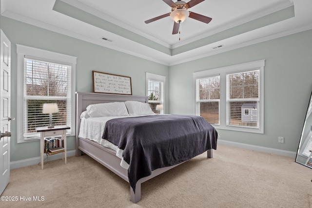 264 Bibey Rd, Carthage, NC 28327 - bedroom featuring a tray ceiling, crown molding, light carpet, a ceiling fan, and baseboards