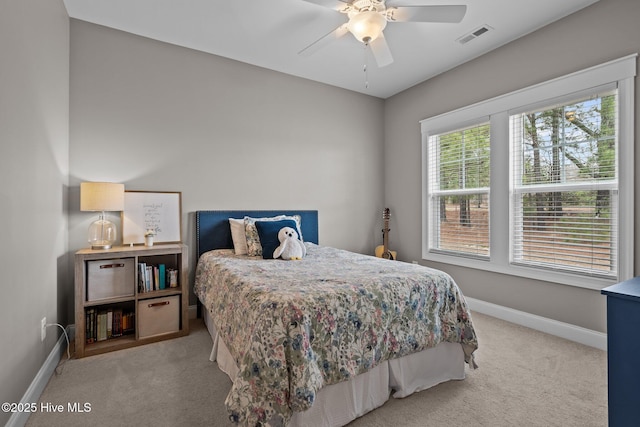 264 Bibey Rd, Carthage, NC 28327 - bedroom with light colored carpet, baseboards, and ceiling fan