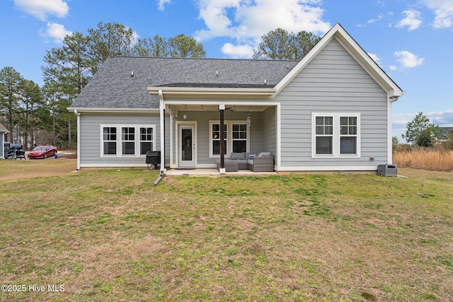 264 Bibey Rd, Carthage, NC 28327 - rear view of house featuring a patio area, an outdoor hangout area, a lawn, and roof with shingles