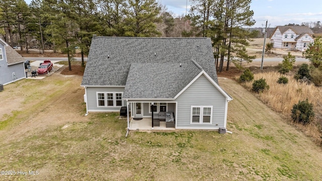 264 Bibey Rd, Carthage, NC 28327 - back of house featuring roof with shingles, a yard, and a patio