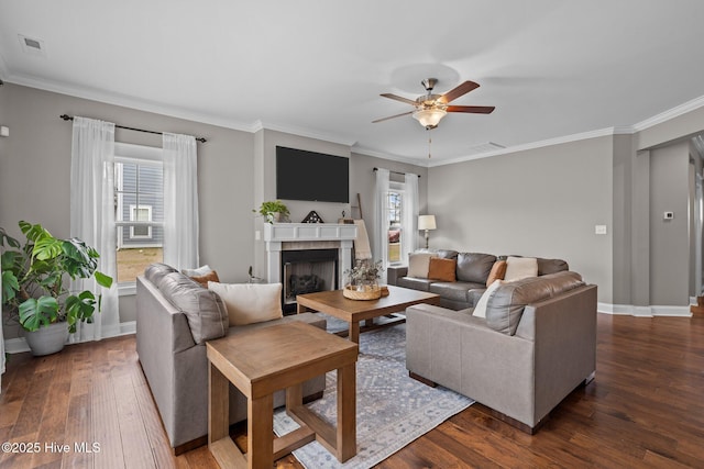264 Bibey Rd, Carthage, NC 28327 - living room featuring plenty of natural light, dark wood-style floors, a ceiling fan, a fireplace, and ornamental molding