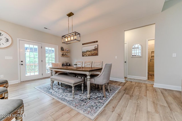 310 Willow Oak Ct, Cameron, NC 28326 - dining area featuring light wood-type flooring, baseboards, and a chandelier