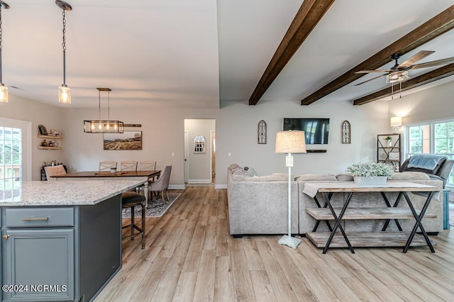 310 Willow Oak Ct, Cameron, NC 28326 - living area featuring light wood-type flooring, ceiling fan, beamed ceiling, and baseboards