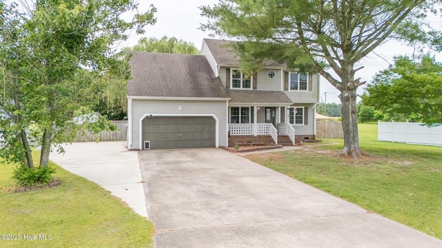 134 Kingsway Way, Moyock, NC 27958 - traditional home featuring a porch, concrete driveway, an attached garage, and roof with shingles