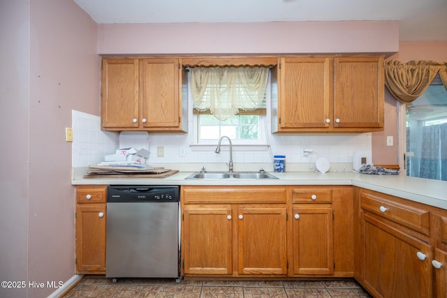 134 Kingsway Way, Moyock, NC 27958 - kitchen featuring stainless steel dishwasher, a sink, light countertops, decorative backsplash, and brown cabinets