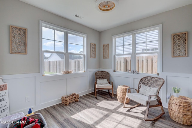 2161 Blue Bonnet Cir, Castle Hayne, NC 28429 - sitting room featuring wood finished floors, a wainscoted wall, and a decorative wall