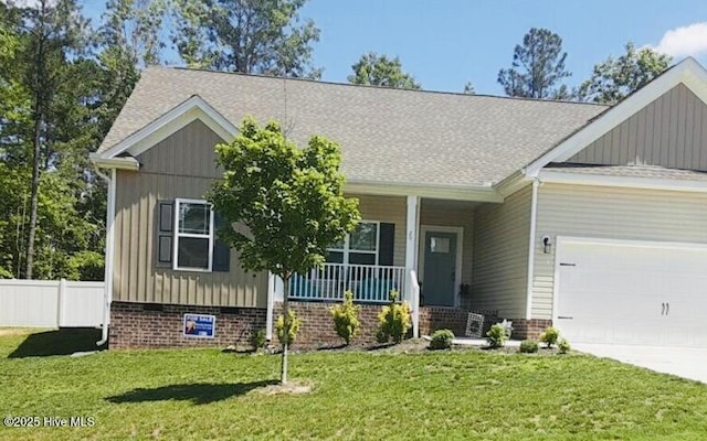 20 Issy Hawk Way, Franklinton, NC 27525 - craftsman-style home with covered porch, an attached garage, board and batten siding, and driveway