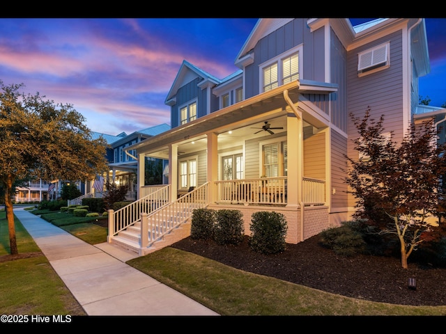 1012 Midnight Channel Rd, Wilmington, NC 28403 - view of front facade with board and batten siding, ceiling fan, and covered porch