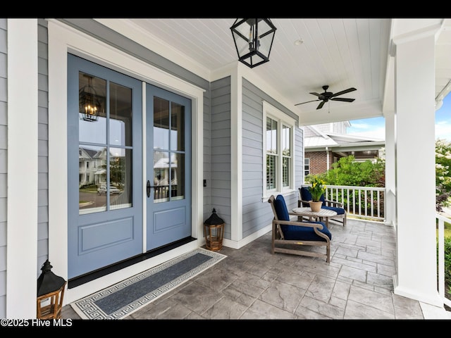 1012 Midnight Channel Rd, Wilmington, NC 28403 - covered porch with a ceiling fan and french doors
