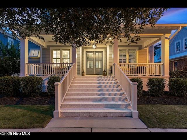1012 Midnight Channel Rd, Wilmington, NC 28403 - view of front of home with a porch, french doors, and stairs