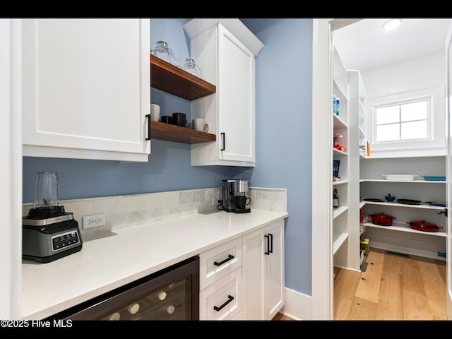1012 Midnight Channel Rd, Wilmington, NC 28403 - kitchen featuring open shelves, light wood-type flooring, white cabinets, and light countertops