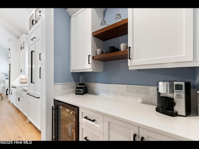 1012 Midnight Channel Rd, Wilmington, NC 28403 - kitchen featuring beverage cooler, open shelves, white cabinetry, and light wood finished floors