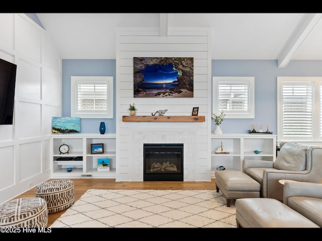 1012 Midnight Channel Rd, Wilmington, NC 28403 - living room featuring wood finished floors, a large fireplace, and plenty of natural light