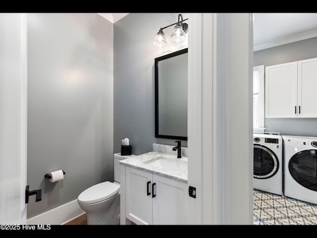 1012 Midnight Channel Rd, Wilmington, NC 28403 - bathroom featuring washing machine and dryer, crown molding, vanity, and toilet