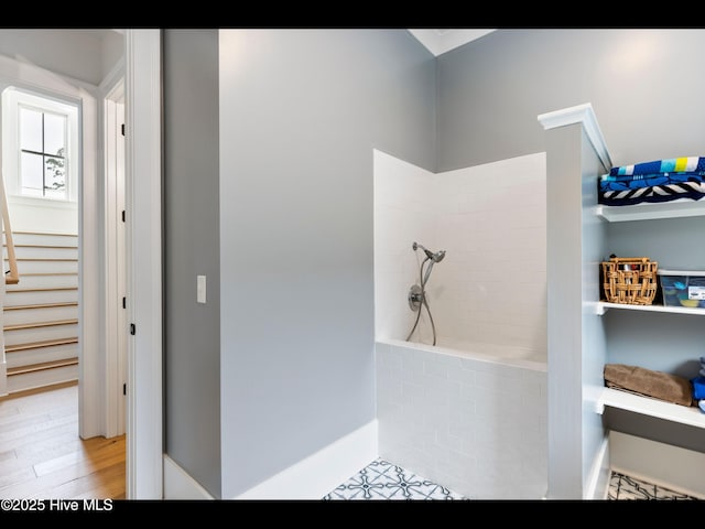 1012 Midnight Channel Rd, Wilmington, NC 28403 - bathroom with a tile shower, wood finished floors, and baseboards