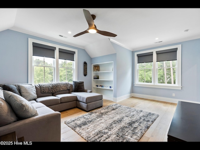 1012 Midnight Channel Rd, Wilmington, NC 28403 - living area featuring a ceiling fan, lofted ceiling, light wood-type flooring, built in shelves, and baseboards