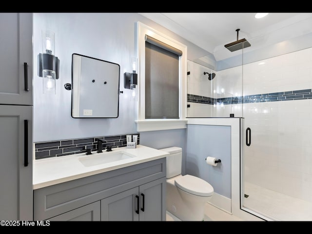 1012 Midnight Channel Rd, Wilmington, NC 28403 - bathroom featuring toilet, a shower stall, vanity, and tasteful backsplash
