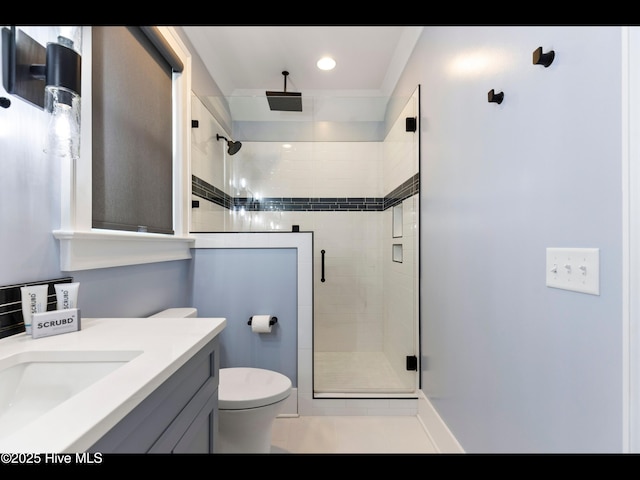 1012 Midnight Channel Rd, Wilmington, NC 28403 - full bathroom featuring a stall shower, vanity, toilet, tile patterned flooring, and ornamental molding