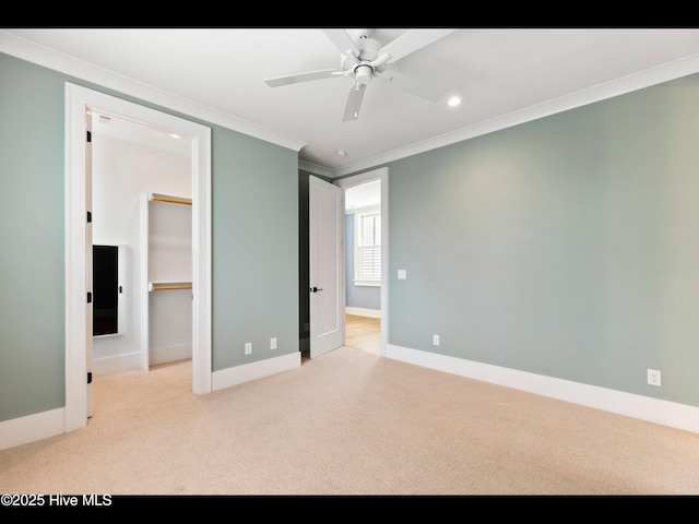 1012 Midnight Channel Rd, Wilmington, NC 28403 - unfurnished bedroom featuring crown molding, carpet flooring, a spacious closet, baseboards, and recessed lighting