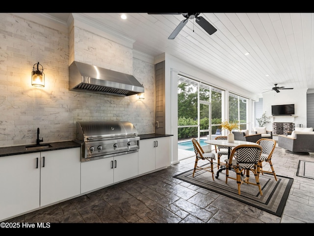 1012 Midnight Channel Rd, Wilmington, NC 28403 - dining area with a ceiling fan, stone tile flooring, recessed lighting, a fireplace, and ornamental molding