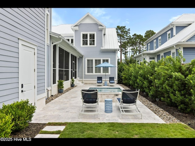 1012 Midnight Channel Rd, Wilmington, NC 28403 - view of patio / terrace with a sunroom and an outdoor pool