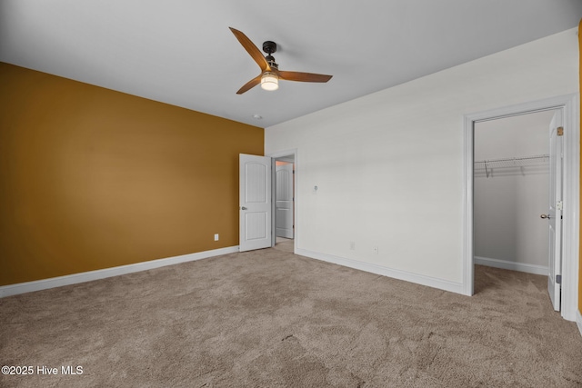 1006 Kingfish Way, New Bern, NC 28562 - unfurnished bedroom with carpet flooring, a walk in closet, a closet, and baseboards