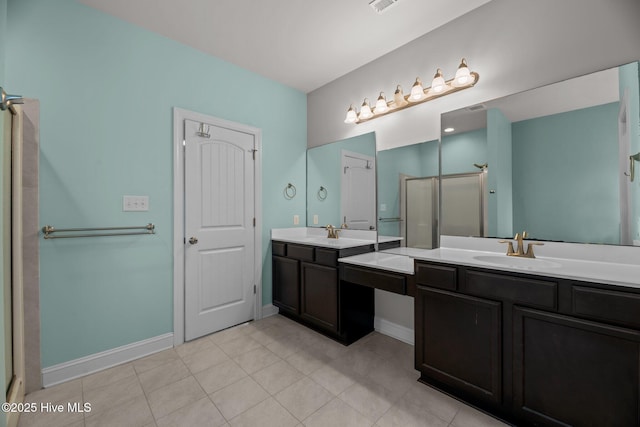 1006 Kingfish Way, New Bern, NC 28562 - full bath featuring two vanities, a shower stall, baseboards, and tile patterned flooring