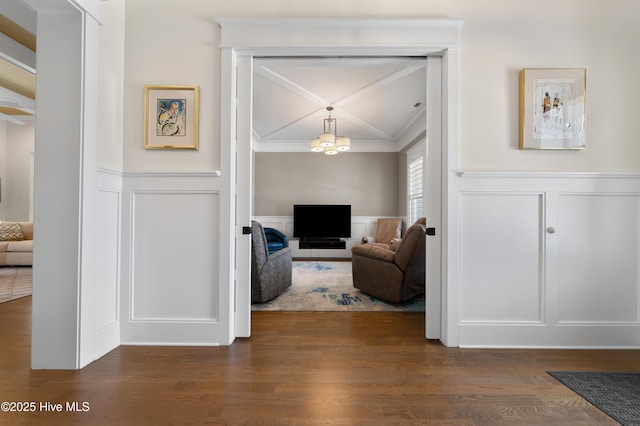 2570 Sugar Maple Ct, Southport, NC 28461 - living room with a decorative wall, a wainscoted wall, ornamental molding, and wood finished floors