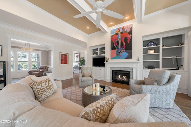 2570 Sugar Maple Ct, Southport, NC 28461 - living room with ornamental molding, a lit fireplace, built in features, wood finished floors, and ceiling fan