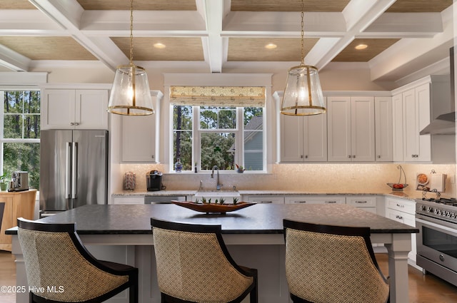 2570 Sugar Maple Ct, Southport, NC 28461 - kitchen with high end appliances, coffered ceiling, backsplash, recessed lighting, and white cabinets