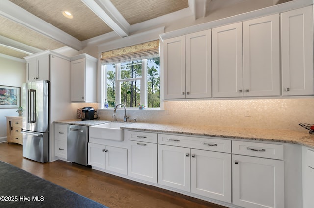 2570 Sugar Maple Ct, Southport, NC 28461 - kitchen with appliances with stainless steel finishes, beamed ceiling, dark wood-style floors, backsplash, and white cabinets