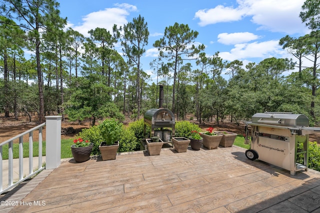 2570 Sugar Maple Ct, Southport, NC 28461 - view of patio featuring a grill and view of wooded area