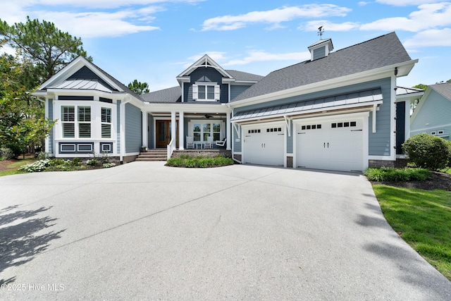 2570 Sugar Maple Ct, Southport, NC 28461 - view of front of property with concrete driveway, a porch, an attached garage, roof with shingles, and a standing seam roof