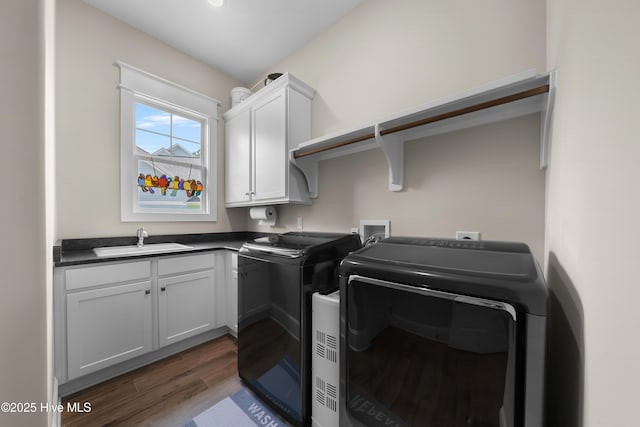 2570 Sugar Maple Ct, Southport, NC 28461 - washroom featuring cabinet space, dark wood-style floors, and washer and dryer
