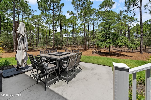 2570 Sugar Maple Ct, Southport, NC 28461 - view of patio with an outdoor fire pit and view of scattered trees