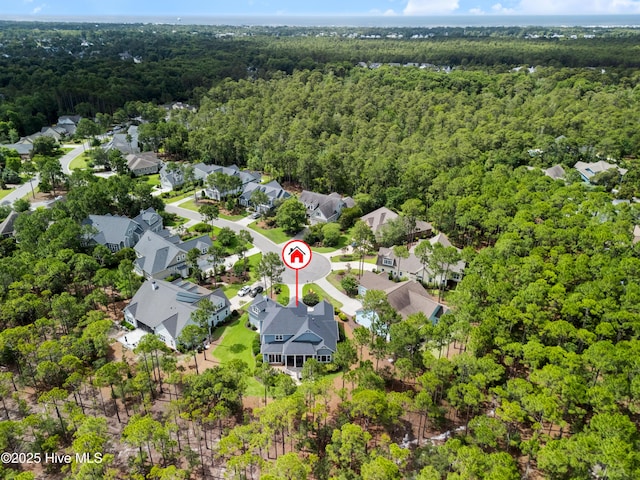 2570 Sugar Maple Ct, Southport, NC 28461 - aerial view of property and surrounding area featuring a forest and nearby suburban area