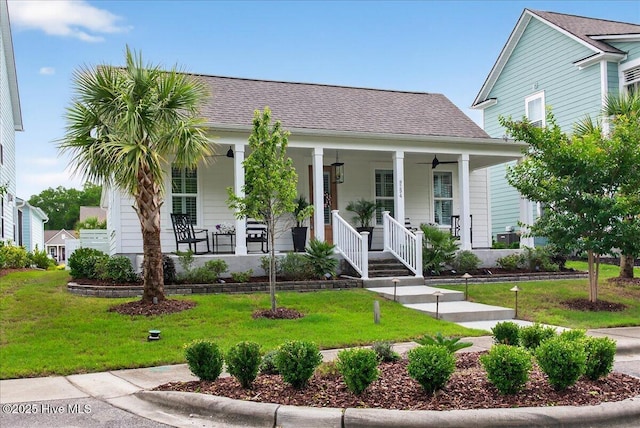 9294 Murphy Way SW, Calabash, NC 28467 - view of front of house featuring covered porch, a front lawn, and a shingled roof