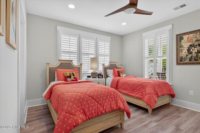 9294 Murphy Way SW, Calabash, NC 28467 - bedroom with wood finished floors, baseboards, recessed lighting, and a ceiling fan