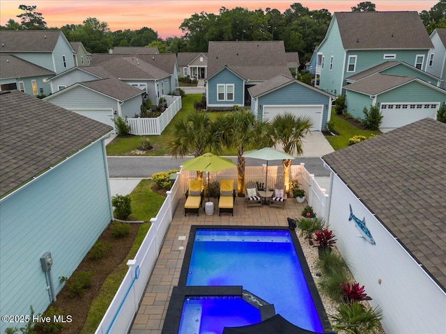 9294 Murphy Way SW, Calabash, NC 28467 - view of swimming pool featuring a residential view, a fenced backyard, an in-ground hot tub, and an outdoor hangout area