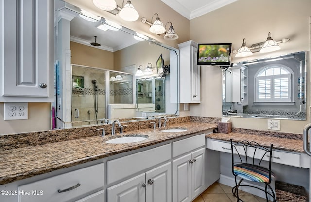2911 Ridge Rd NW, Wilson, NC 27896 - bathroom with ornamental molding, a stall shower, double vanity, and tile patterned flooring