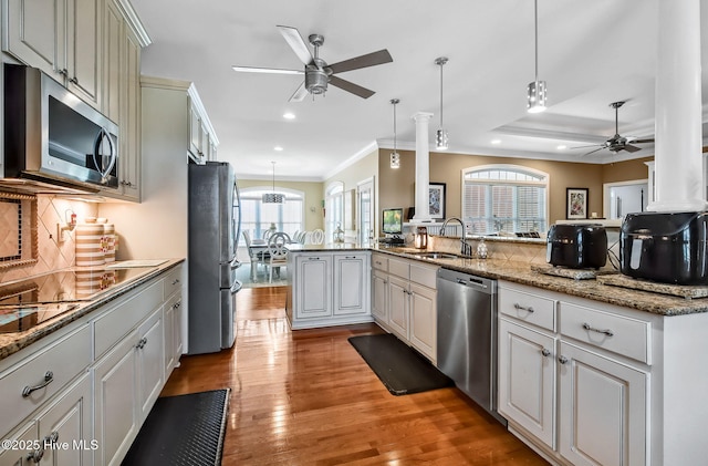 2911 Ridge Rd NW, Wilson, NC 27896 - kitchen with appliances with stainless steel finishes, ceiling fan, a sink, recessed lighting, and light wood-type flooring