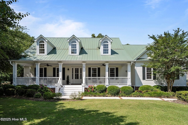 103 Low Country Ct, Hampstead, NC 28443 - cape cod house with ceiling fan, a porch, a front lawn, and metal roof