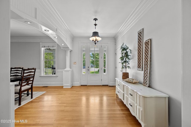103 Low Country Ct, Hampstead, NC 28443 - foyer featuring ornamental molding, light wood-style flooring, and ornate columns