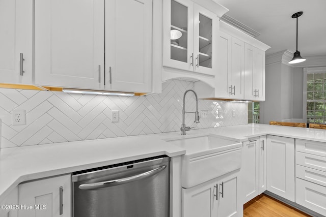 103 Low Country Ct, Hampstead, NC 28443 - kitchen with dishwasher, white cabinets, a sink, and light countertops
