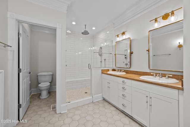 103 Low Country Ct, Hampstead, NC 28443 - bathroom featuring a shower stall, double vanity, crown molding, toilet, and tile patterned floors